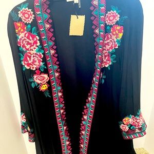 Andre light material jacket. Can be worn over a tank top with jeans or shorts.